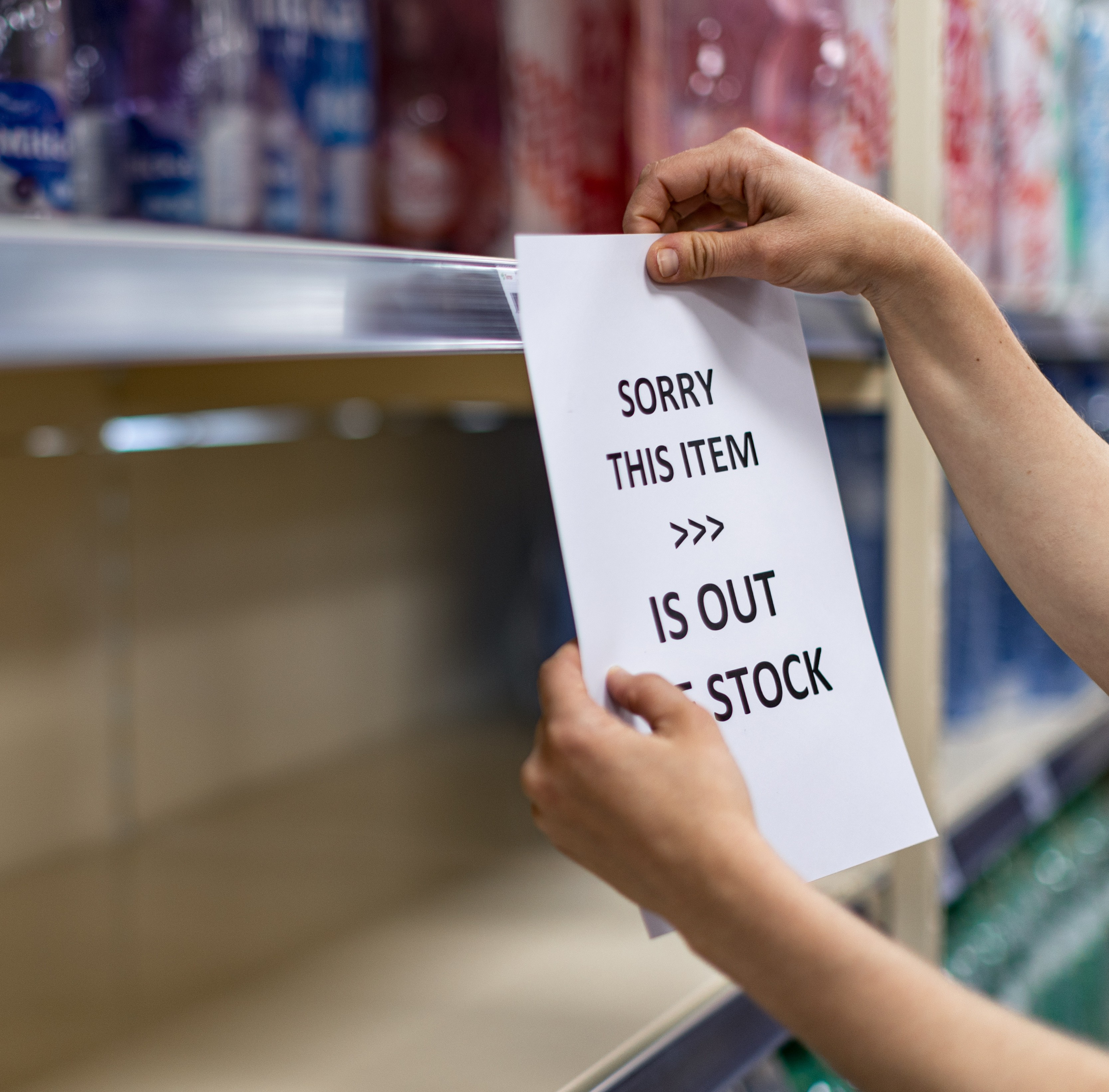 Person placing note on shelf.